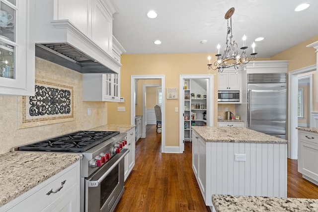 24 N Racebrook Rd, Woodbridge, CT 06525 - kitchen featuring built in appliances, dark wood finished floors, backsplash, a chandelier, and recessed lighting