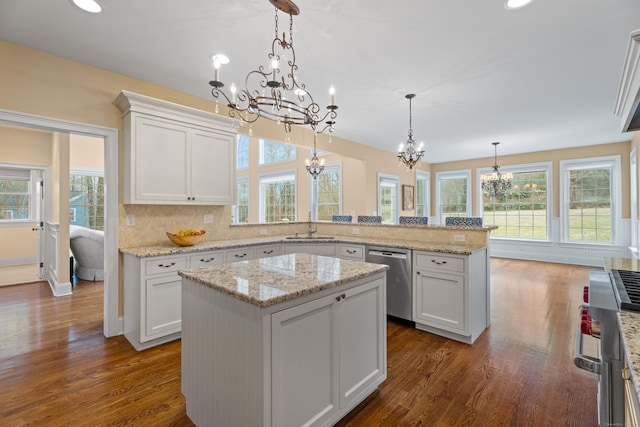 24 N Racebrook Rd, Woodbridge, CT 06525 - kitchen with dishwasher, a chandelier, a sink, a peninsula, and healthy amount of natural light