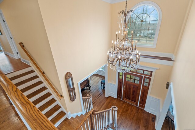 24 N Racebrook Rd, Woodbridge, CT 06525 - foyer entrance with a towering ceiling, a chandelier, and wood finished floors