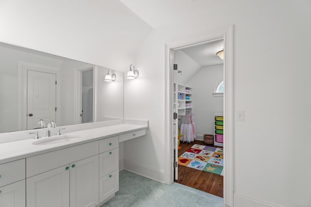 24 N Racebrook Rd, Woodbridge, CT 06525 - bathroom with lofted ceiling, vanity, and baseboards