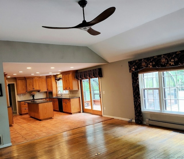 15 Packer Brook Rd, Redding, CT 06896 - kitchen featuring ceiling fan, brown cabinets, dishwasher, decorative backsplash, and a center island