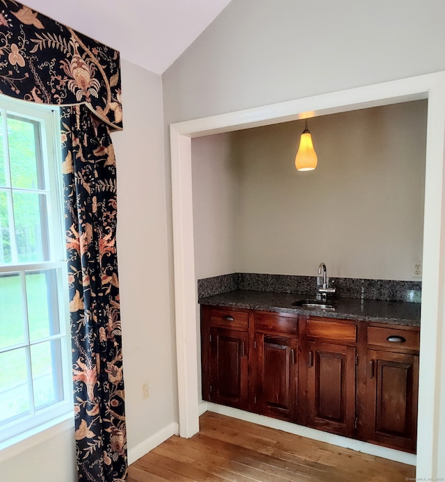 15 Packer Brook Rd, Redding, CT 06896 - indoor wet bar featuring light wood-style floors, lofted ceiling, and baseboards