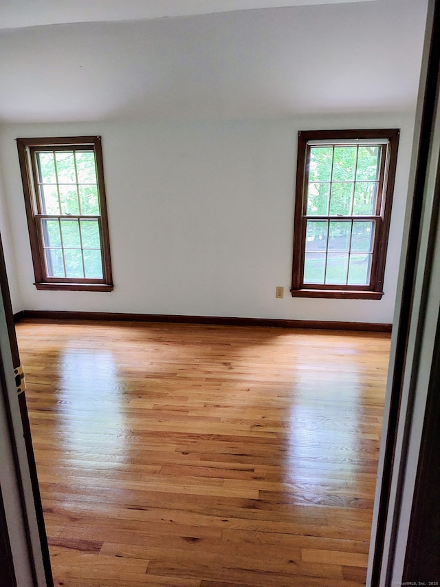15 Packer Brook Rd, Redding, CT 06896 - unfurnished room featuring plenty of natural light, wood finished floors, and baseboards