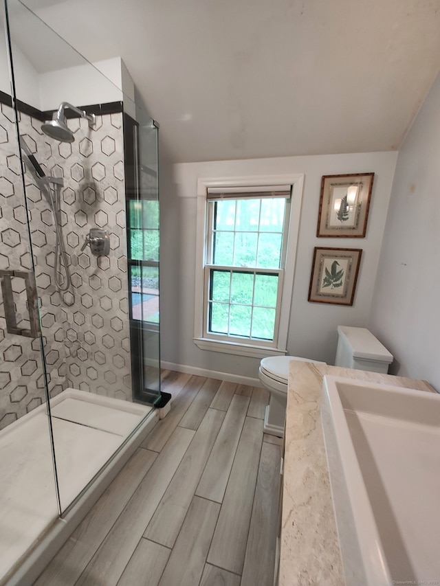 15 Packer Brook Rd, Redding, CT 06896 - bathroom with a tile shower, toilet, and wood finish floors