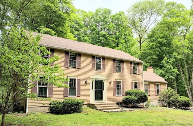 15 Packer Brook Rd, Redding, CT 06896 - colonial inspired home featuring a front lawn and a chimney