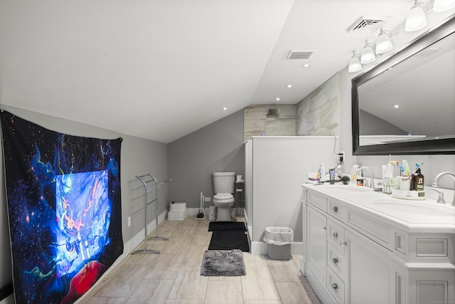 full bath with vaulted ceiling, toilet, double vanity, walk in shower, and baseboards