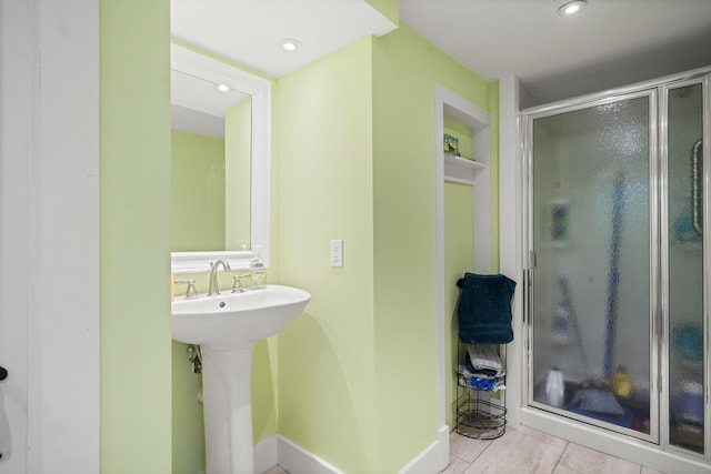 full bathroom with a stall shower, tile patterned floors, recessed lighting, and a sink