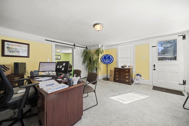 home office with carpet floors and a barn door