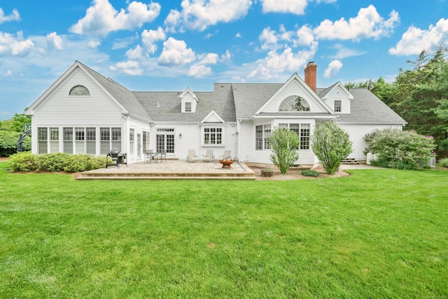 207 Great Pond Rd, Simsbury, CT 06070 - back of property with a lawn, a deck, a chimney, and roof with shingles