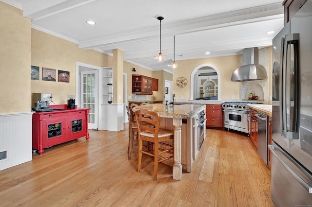 207 Great Pond Rd, Simsbury, CT 06070 - kitchen with appliances with stainless steel finishes, wall chimney range hood, light wood-type flooring, beam ceiling, and a breakfast bar