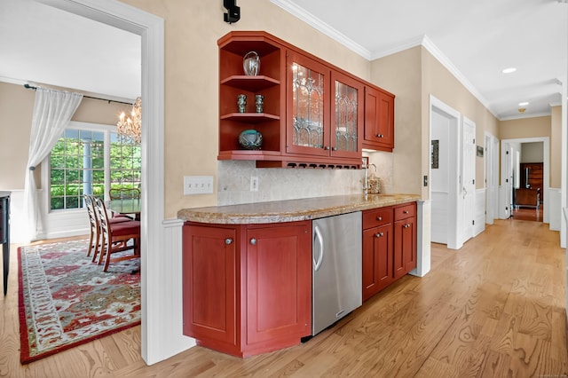 207 Great Pond Rd, Simsbury, CT 06070 - kitchen featuring fridge, light wood finished floors, ornamental molding, tasteful backsplash, and glass insert cabinets