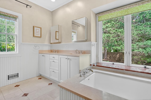 207 Great Pond Rd, Simsbury, CT 06070 - full bath with a wainscoted wall, double vanity, tile patterned floors, and a tub