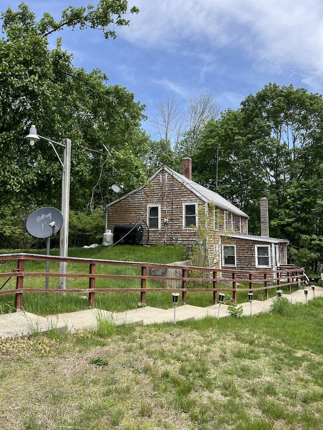 1100 Plainfield Pike, Sterling, CT 06373 - view of home's exterior featuring a chimney and view of wooded area