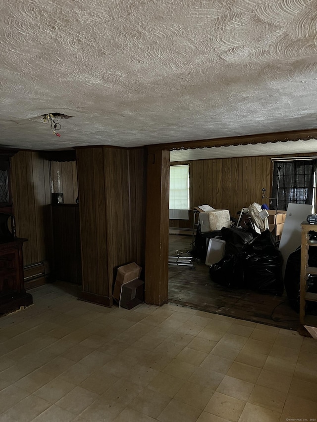1100 Plainfield Pike, Sterling, CT 06373 - living area with wood walls, a textured ceiling, and light floors