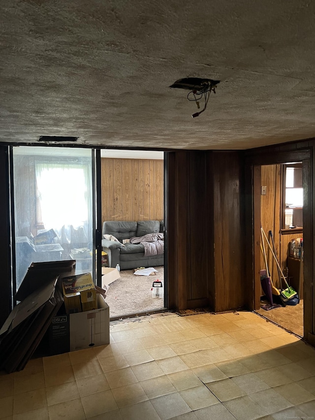 1100 Plainfield Pike, Sterling, CT 06373 - empty room with tile patterned floors and wood walls