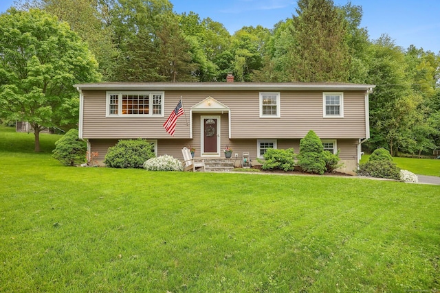 8 Brookview Ct, Bethel, CT 06801 - bi-level home featuring a front yard and a chimney