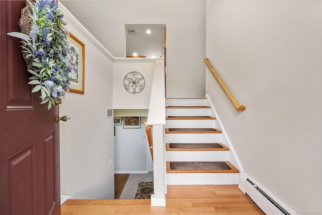 8 Brookview Ct, Bethel, CT 06801 - stairs with baseboard heating, wood finished floors, and recessed lighting
