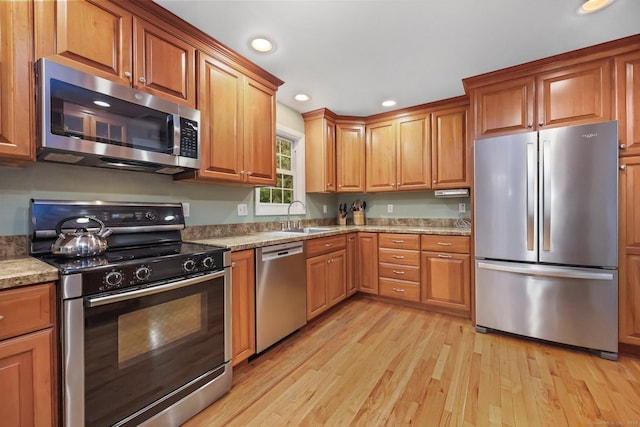 8 Brookview Ct, Bethel, CT 06801 - kitchen with appliances with stainless steel finishes, a sink, light wood-style floors, recessed lighting, and brown cabinetry