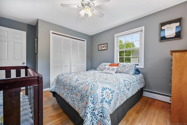 8 Brookview Ct, Bethel, CT 06801 - bedroom with baseboard heating, a closet, wood finished floors, and ceiling fan