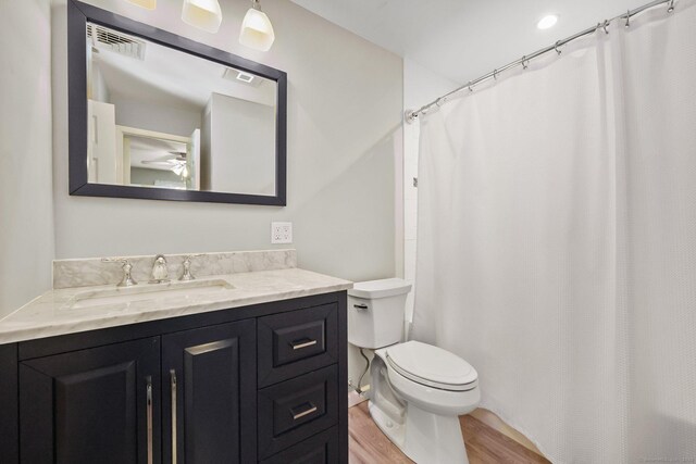 8 Brookview Ct, Bethel, CT 06801 - full bathroom with wood finished floors, vanity, toilet, and a shower with curtain
