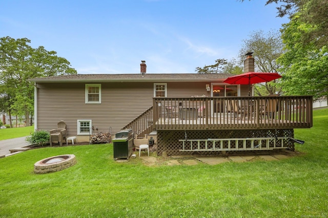 8 Brookview Ct, Bethel, CT 06801 - back of property with a fire pit, a chimney, a lawn, and a wooden deck