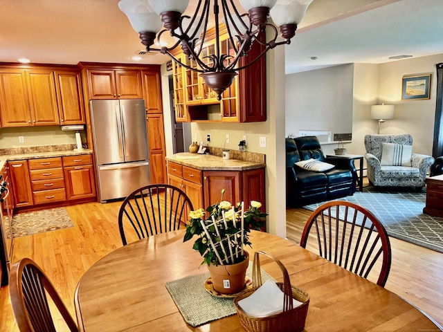 8 Brookview Ct, Bethel, CT 06801 - dining space with light wood-type flooring and a chandelier