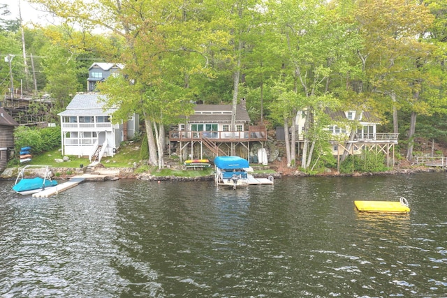 dock area featuring stairs and a water view