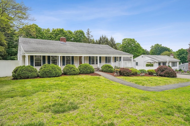 81 Edward St, Newington, CT 06111 - view of front of house with a chimney, a porch, and a shingled roof
