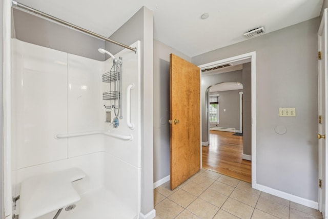 81 Edward St, Newington, CT 06111 - bathroom featuring tile patterned floors, baseboard heating, baseboards, and a shower