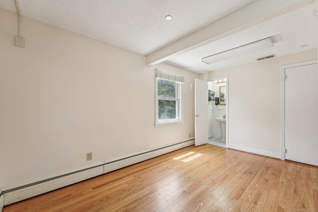 81 Edward St, Newington, CT 06111 - unfurnished bedroom with a baseboard radiator, light wood-style floors, a textured ceiling, ensuite bath, and beamed ceiling