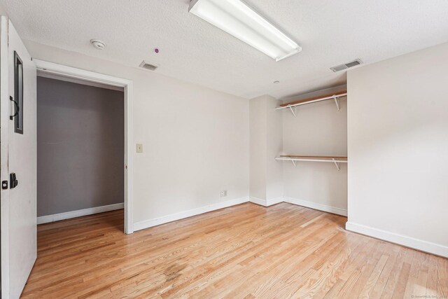 81 Edward St, Newington, CT 06111 - empty room featuring wood finished floors, a smoke detector, and baseboards