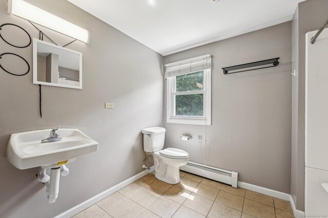 81 Edward St, Newington, CT 06111 - bathroom with a baseboard radiator, toilet, baseboards, and tile patterned floors