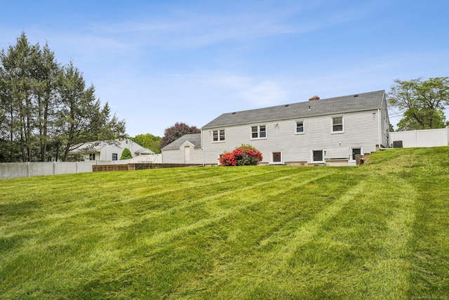 81 Edward St, Newington, CT 06111 - rear view of property featuring a chimney