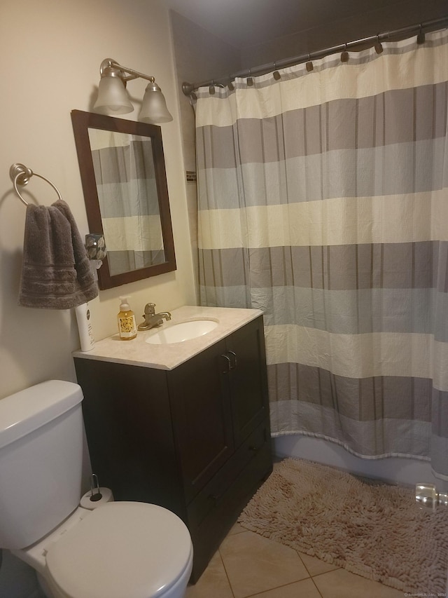 725 Merritt St, Bridgeport, CT 06606 - bathroom with toilet, vanity, tile patterned flooring, and a shower with shower curtain