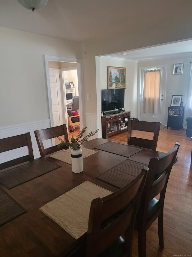 725 Merritt St, Bridgeport, CT 06606 - dining area featuring wainscoting and wood finished floors