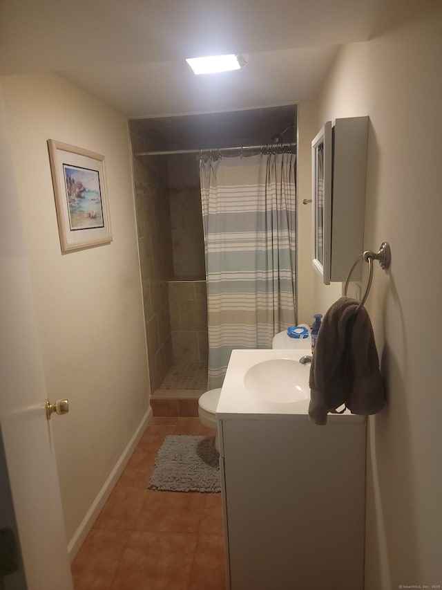 725 Merritt St, Bridgeport, CT 06606 - bathroom featuring vanity, tiled shower, toilet, tile patterned floors, and baseboards