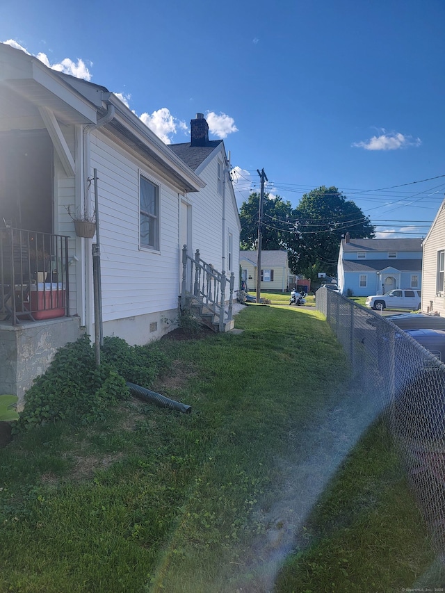 725 Merritt St, Bridgeport, CT 06606 - view of side of home with a chimney and crawl space