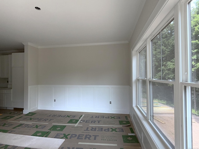23 Melrose Dr, Cheshire, CT 06410 - spare room featuring ornamental molding, a decorative wall, and wainscoting