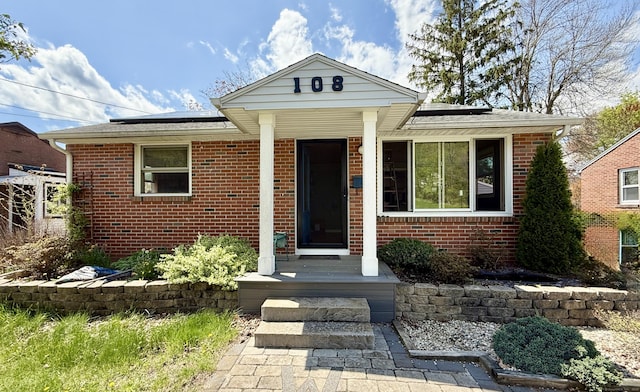 108 Dartmouth St, Torrington, CT 06790 - view of front facade with solar panels and brick siding