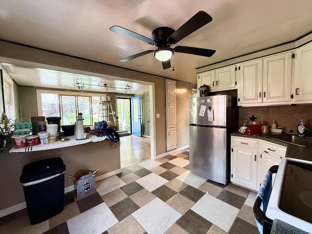 108 Dartmouth St, Torrington, CT 06790 - kitchen with freestanding refrigerator, electric range oven, dark countertops, backsplash, and baseboards