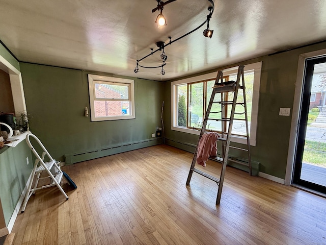 108 Dartmouth St, Torrington, CT 06790 - unfurnished dining area with a baseboard radiator, wood-type flooring, and healthy amount of natural light