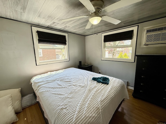 108 Dartmouth St, Torrington, CT 06790 - bedroom with a wall mounted air conditioner, wood finished floors, and a ceiling fan