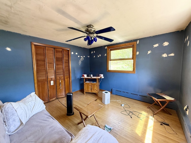 108 Dartmouth St, Torrington, CT 06790 - living area with baseboard heating, light wood-style flooring, ceiling fan, and baseboards