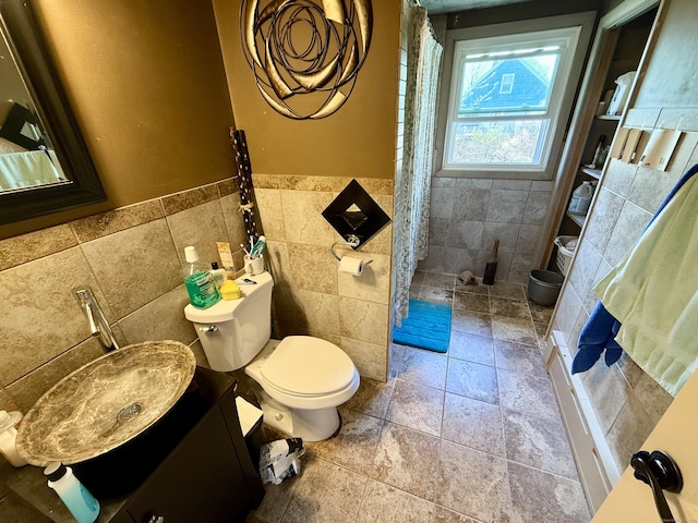 108 Dartmouth St, Torrington, CT 06790 - full bathroom featuring tile walls, a shower stall, toilet, vanity, and a wainscoted wall
