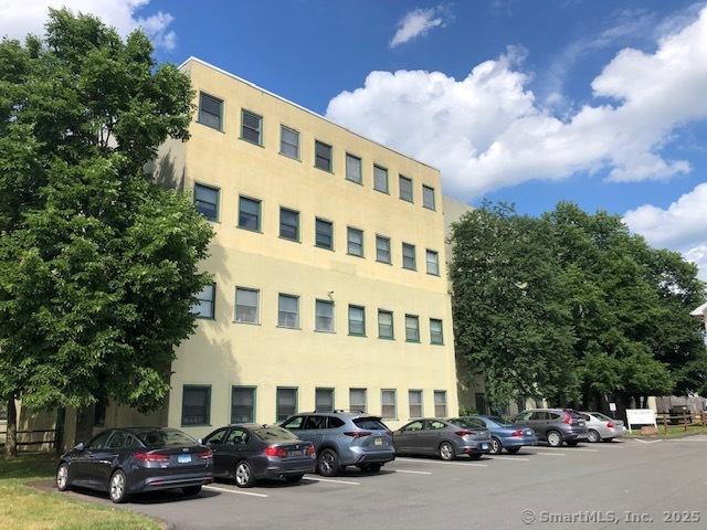 452 Judd Sq Unit 452, Wallingford, CT 06492 - view of property featuring uncovered parking