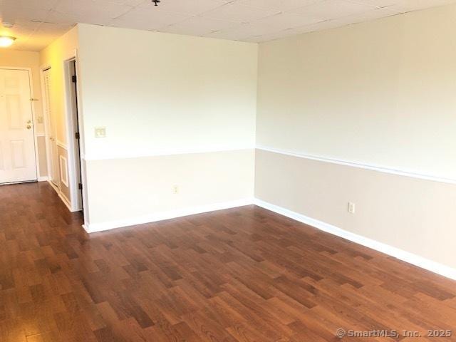 452 Judd Sq Unit 452, Wallingford, CT 06492 - empty room featuring dark wood finished floors and baseboards