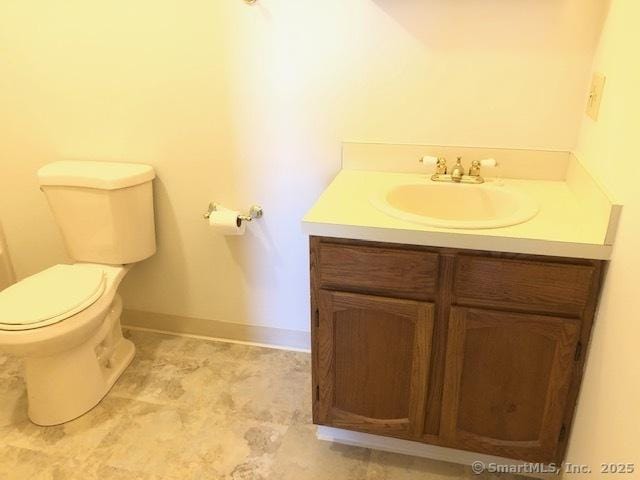 452 Judd Sq Unit 452, Wallingford, CT 06492 - half bathroom with vanity, toilet, and baseboards