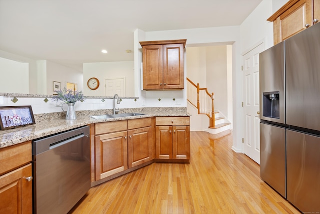 1 Chatham Ct Unit 1, Middlebury, CT 06762 - kitchen featuring stainless steel appliances, a sink, light wood-style flooring, light stone counters, and recessed lighting