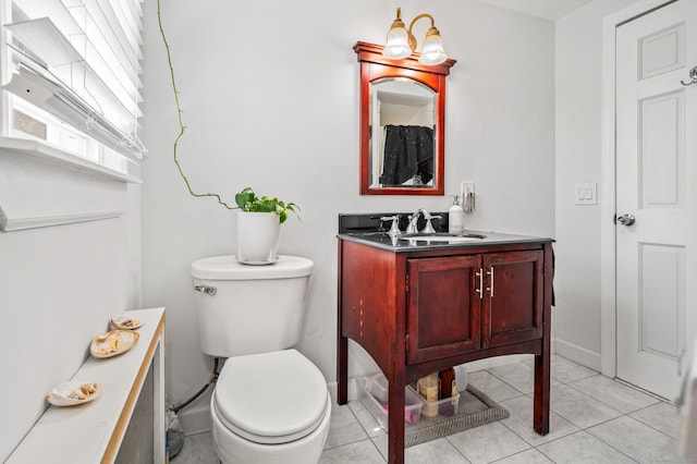 54 Swampscott Rd, Stamford, CT 06905 - bathroom with toilet, vanity, tile patterned flooring, and baseboards