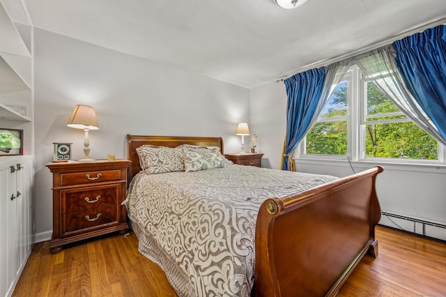 54 Swampscott Rd, Stamford, CT 06905 - bedroom featuring wood finished floors and a baseboard radiator